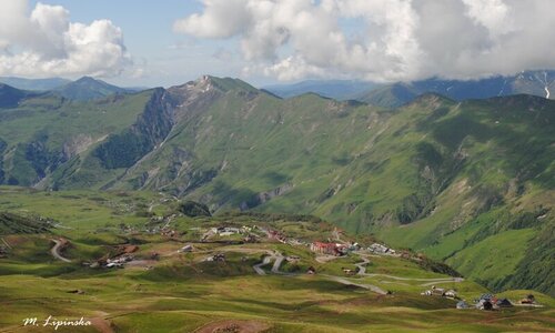 Mountain landscape. A town at the foot of the mountain.